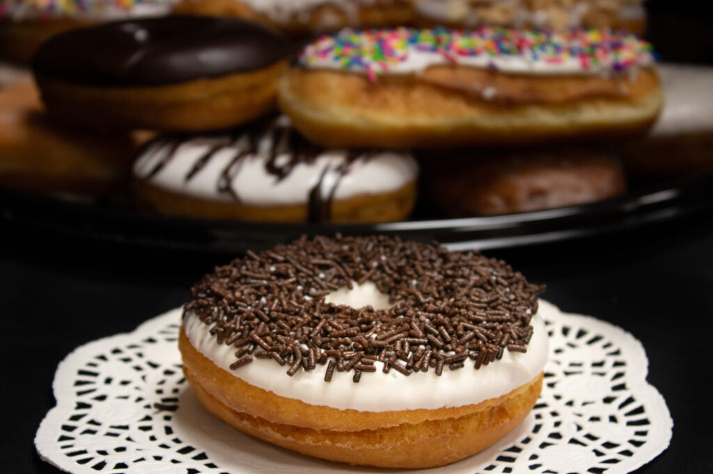 Iced Raised Ring Donuts with Chocolate Jimmies