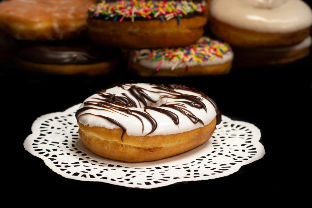 White Zebra Iced Raised Ring Donuts